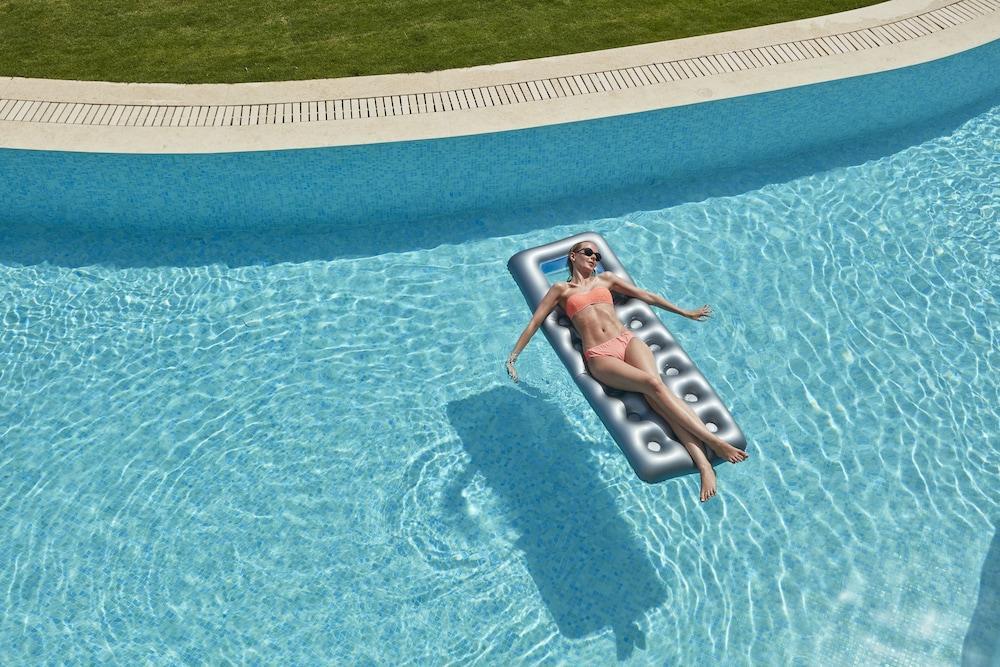 Elissa Adults-Only Lifestyle Beach Resort Kallithéa Exterior foto A woman on a pool float